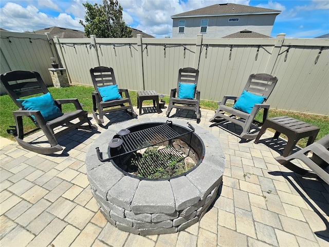 view of patio featuring an outdoor fire pit