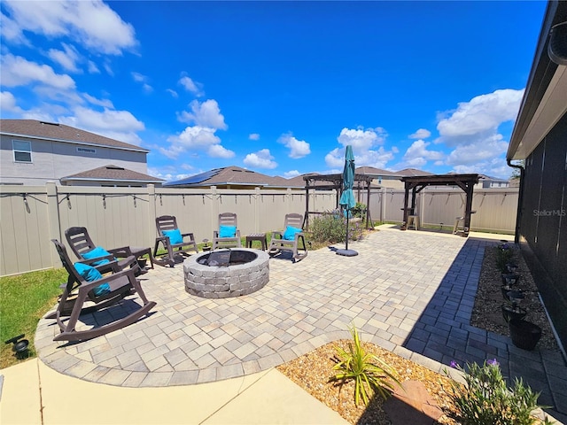 view of patio featuring a fire pit and a pergola