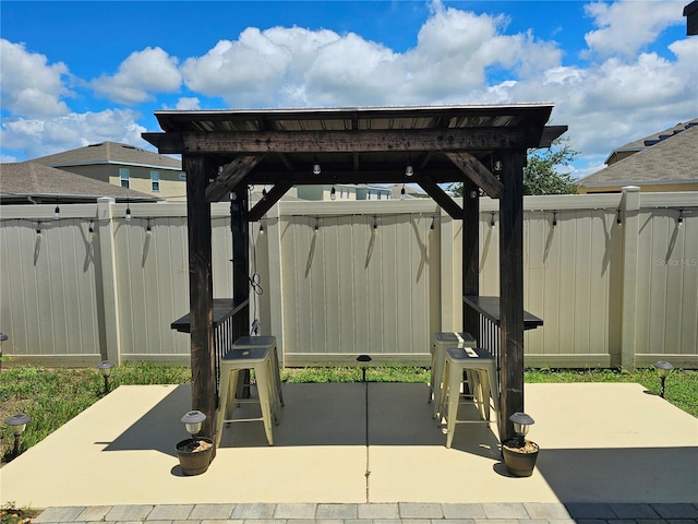 exterior space with a pergola and a patio