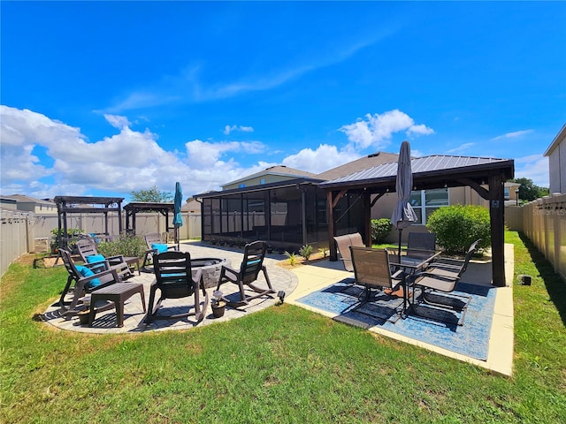 view of yard with a patio area and a sunroom