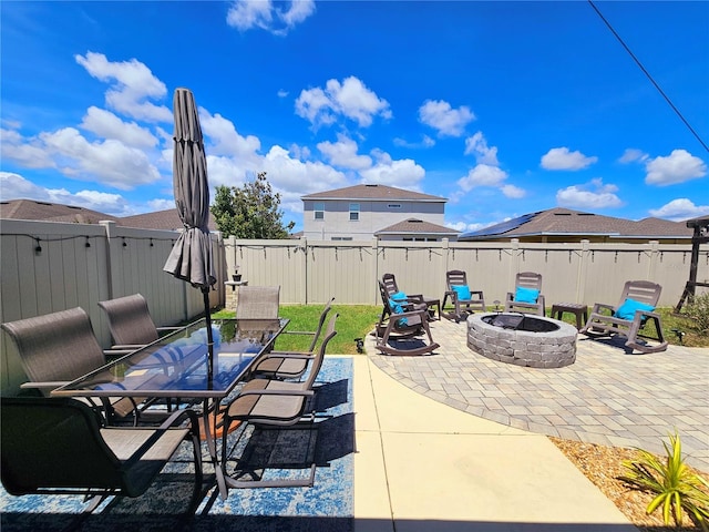 view of patio with an outdoor fire pit