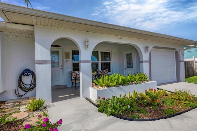 exterior space with a garage and covered porch