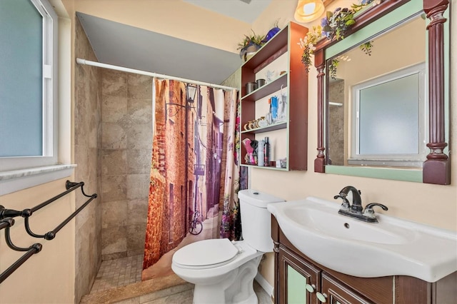 bathroom featuring a shower with curtain, vanity, and toilet