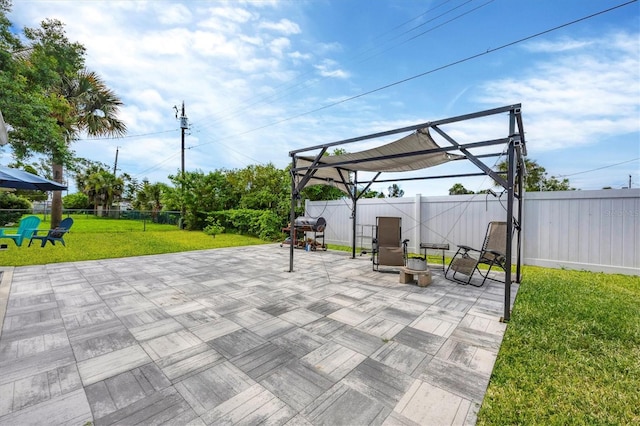 view of patio featuring area for grilling and a pergola