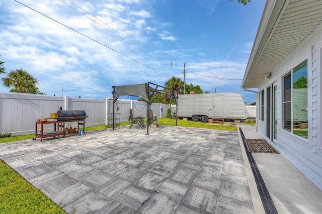 view of patio featuring a storage shed