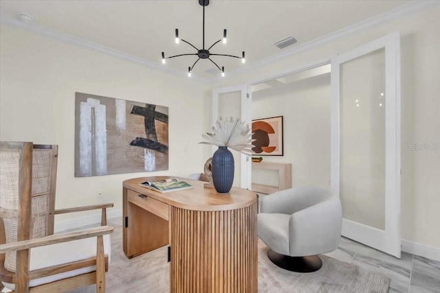 sitting room with a chandelier and crown molding