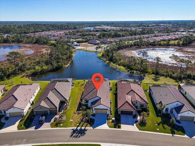 drone / aerial view featuring a water view