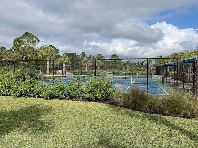 view of sport court featuring a yard