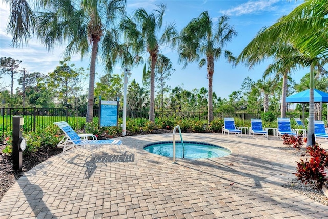 view of pool with a community hot tub and a patio