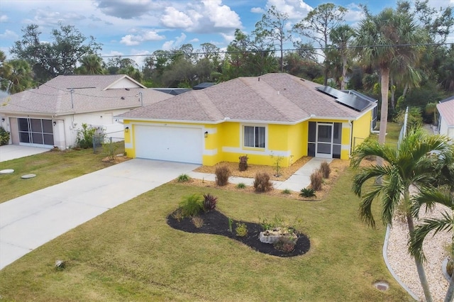 ranch-style home with a garage, a front lawn, and solar panels