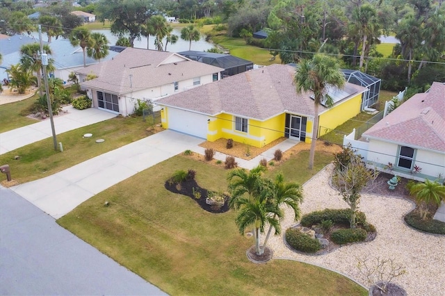 birds eye view of property with a water view