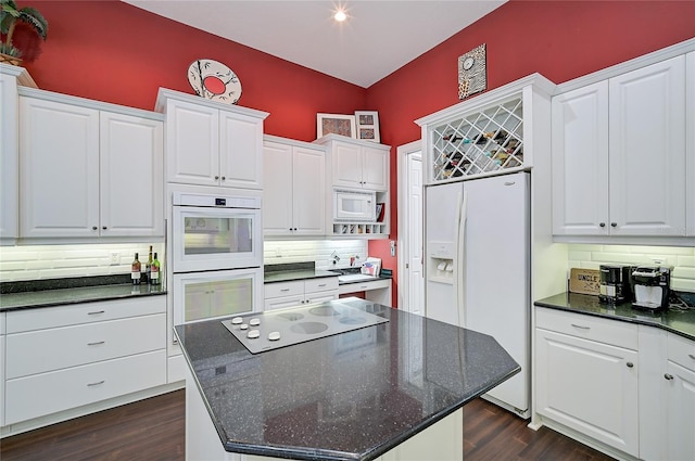 kitchen with white cabinetry and white appliances