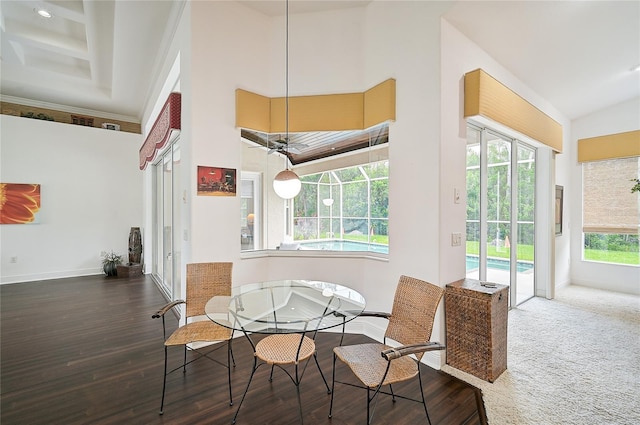 dining space featuring a high ceiling, a wealth of natural light, coffered ceiling, and ceiling fan