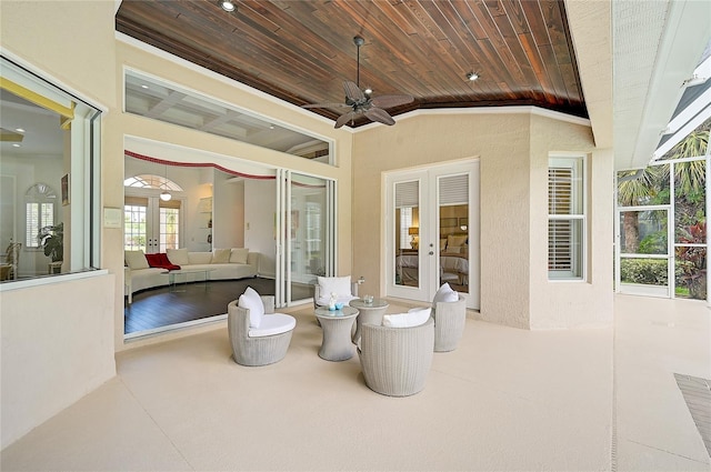 view of patio featuring ceiling fan and french doors