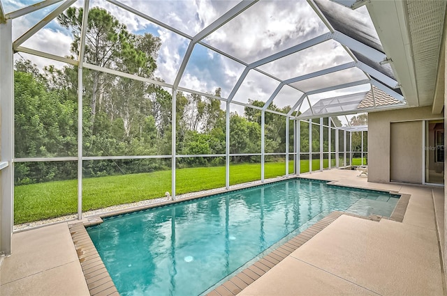 view of swimming pool with a lawn, a lanai, and a patio