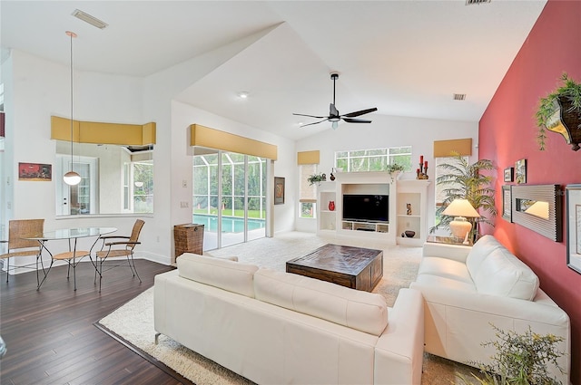 living room with vaulted ceiling, ceiling fan, and dark wood-type flooring