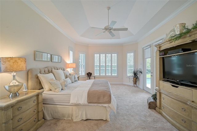 carpeted bedroom featuring access to exterior, a raised ceiling, ceiling fan, and crown molding