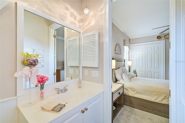 bedroom featuring sink and ornamental molding