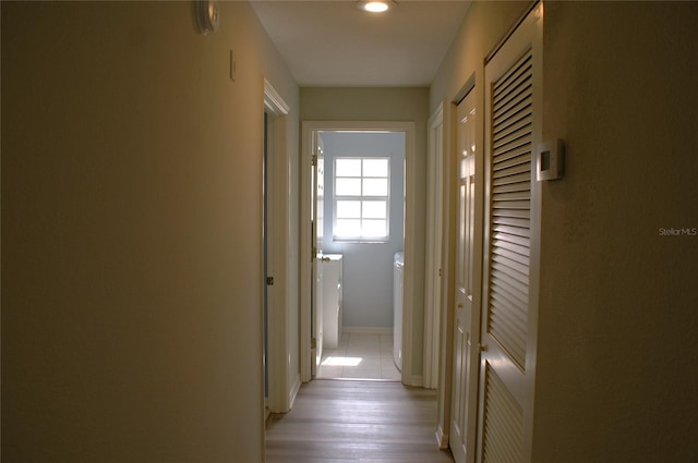 corridor featuring washer / clothes dryer