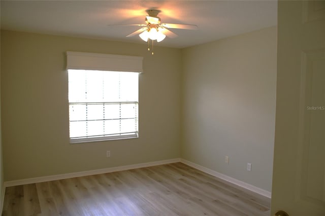 spare room featuring ceiling fan and light hardwood / wood-style flooring