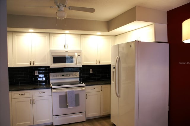 kitchen featuring white cabinetry, white appliances, and tasteful backsplash