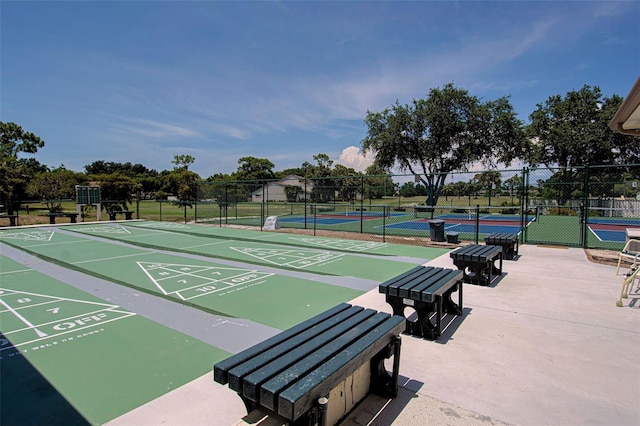 view of community with tennis court