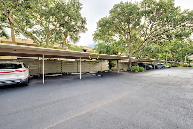 view of vehicle parking with a carport