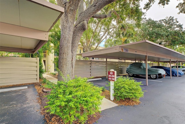 view of parking / parking lot with a carport