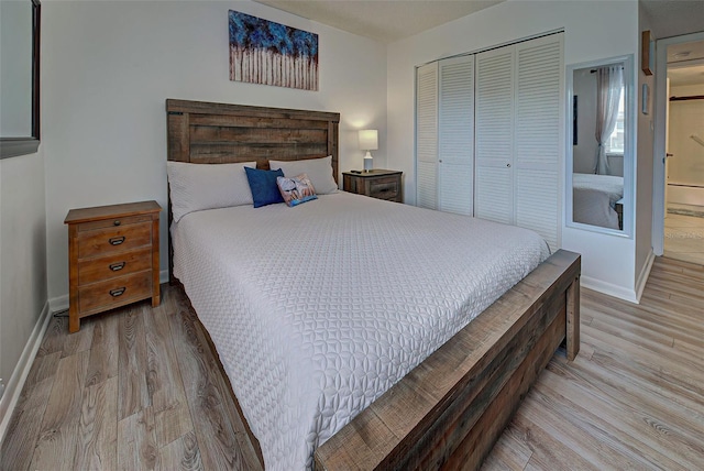 bedroom featuring light hardwood / wood-style floors and a closet