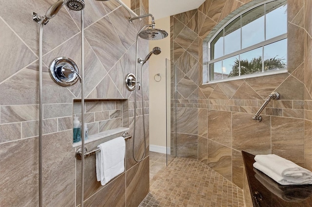 bathroom with tiled shower