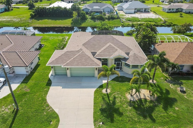 birds eye view of property featuring a water view