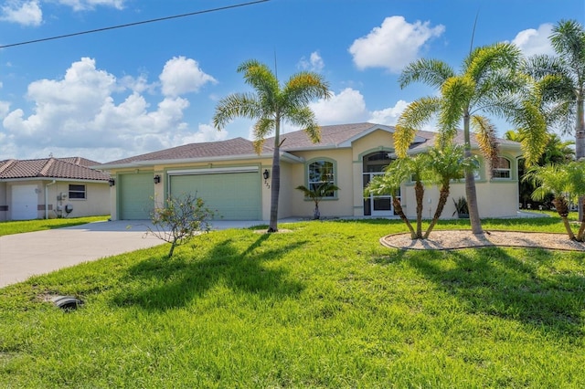 ranch-style home with stucco siding, a front yard, a garage, and driveway