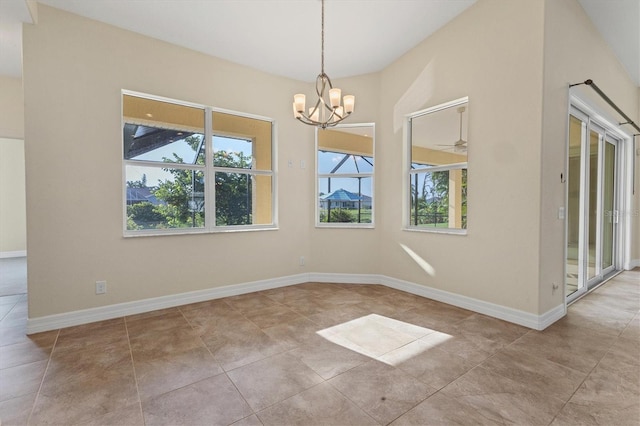 unfurnished dining area with tile patterned floors, baseboards, and an inviting chandelier