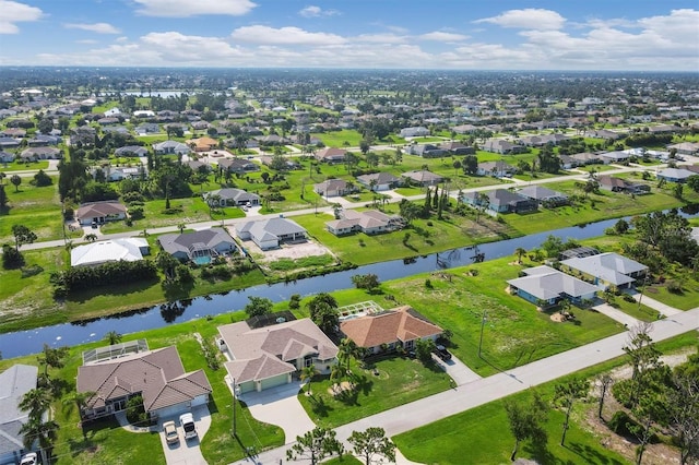 aerial view featuring a residential view and a water view