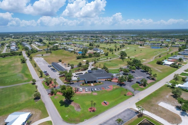 drone / aerial view featuring a water view and golf course view