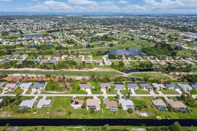 bird's eye view with a residential view and a water view