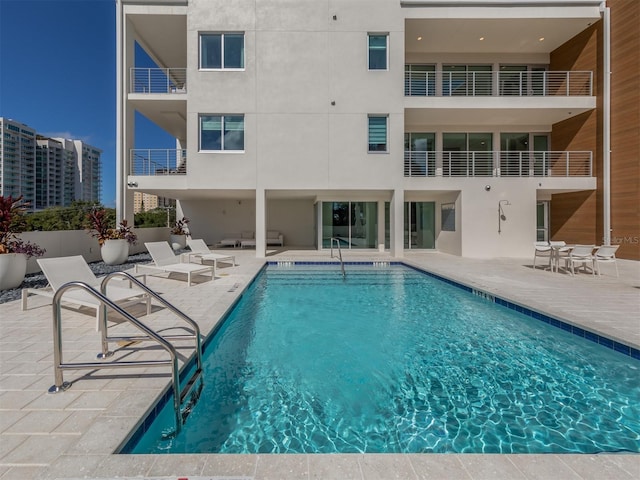 view of swimming pool with a patio area