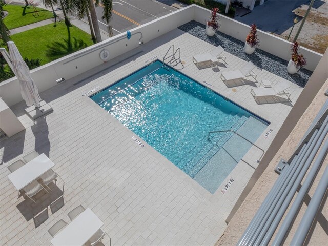 view of swimming pool with a patio