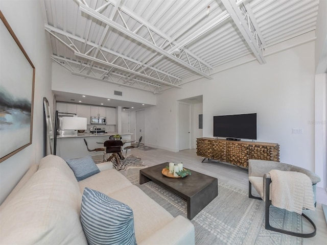 living room with a high ceiling