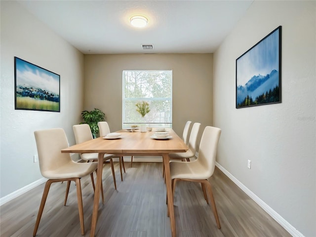 dining area featuring hardwood / wood-style flooring