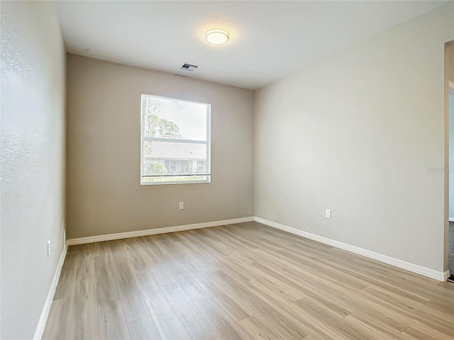 empty room with light hardwood / wood-style floors