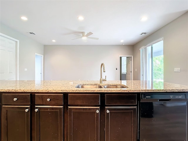 kitchen featuring ceiling fan, sink, black dishwasher, light stone countertops, and dark brown cabinets