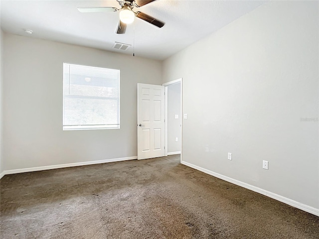 carpeted empty room featuring ceiling fan