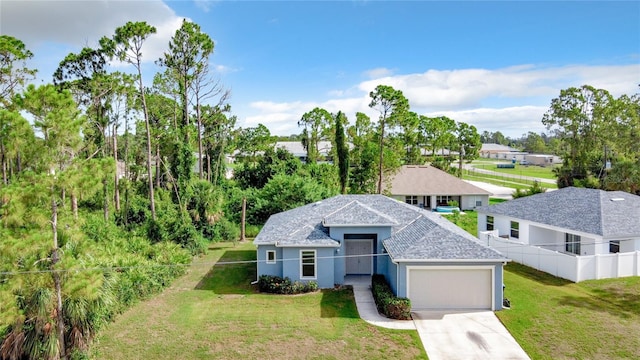 view of front of property with a front lawn and a garage