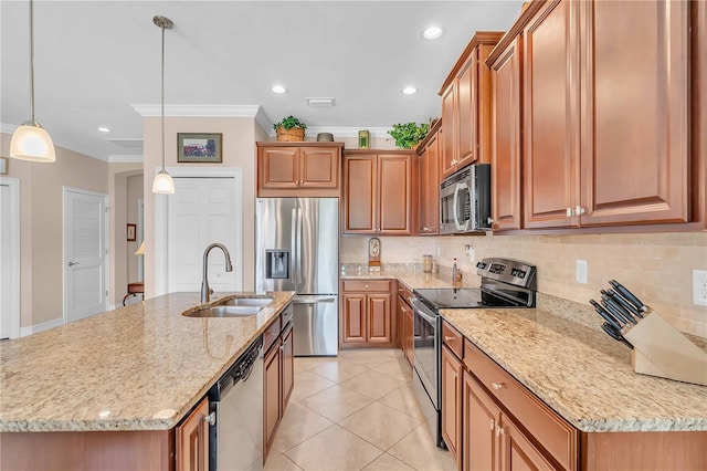 kitchen featuring pendant lighting, sink, a kitchen island with sink, stainless steel appliances, and light stone countertops