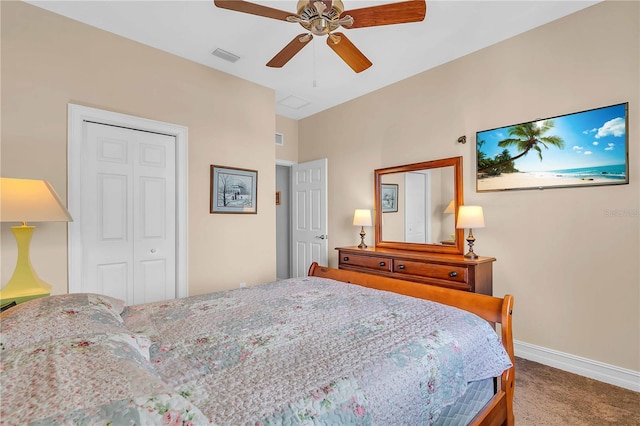 carpeted bedroom featuring ceiling fan and a closet