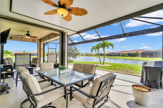 view of patio / terrace with grilling area, a water view, and ceiling fan