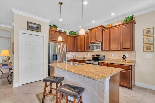 kitchen with crown molding, light tile patterned floors, appliances with stainless steel finishes, and a sink