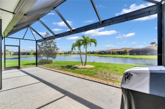 unfurnished sunroom with a water view