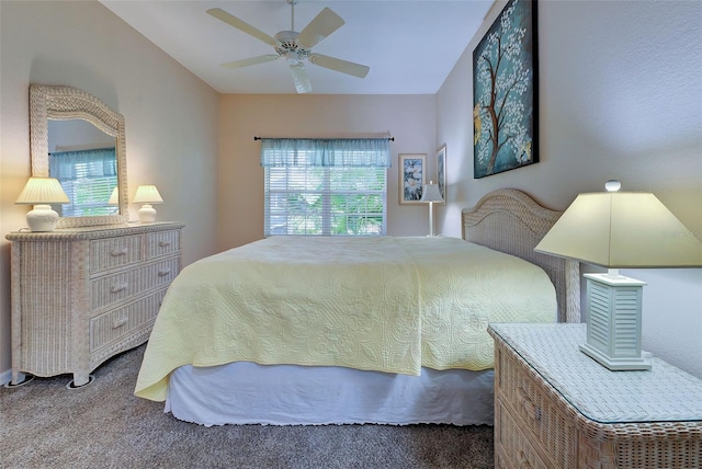 bedroom with ceiling fan and carpet flooring